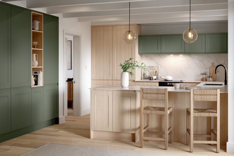 Warm, welcoming country-style kitchen pairing smoke green shaker doors with light Vicenza oak
