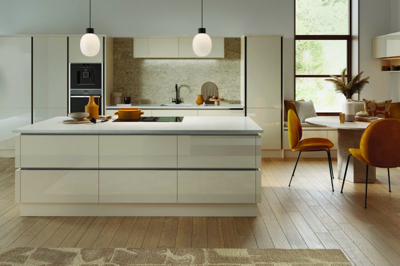 Sleek, light-filled modern kitchen with cream high-gloss inrail Venice doors