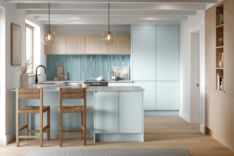 Calm, characterful family kitchen mixing Scandinavian blue shaker doors with light Vicenza oak