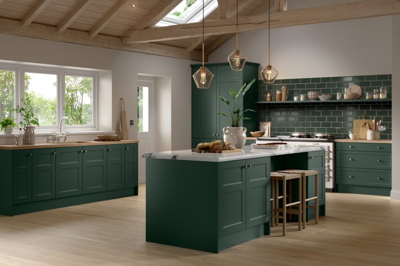 Calm, characterful country-style kitchen featuring deep fir green shaker doors