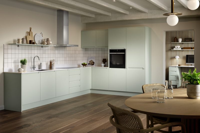 Fresh, characterful family kitchen with soft pistachio green handleless doors